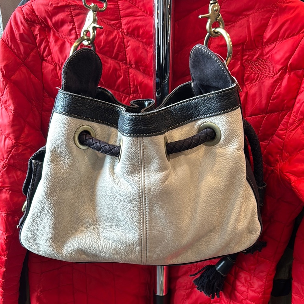Kenneth Cole Reaction Black and Cream lea Shoulder Bag with Drawstring Design